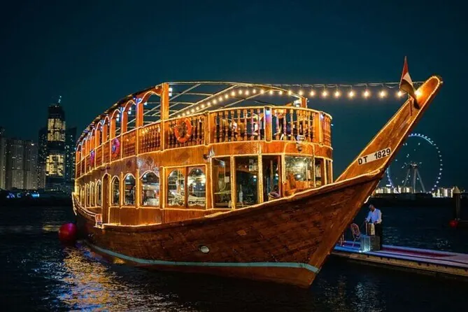 Traditional wooden dhow lit up at night on Doha waterfront on a Doha dhow cruise