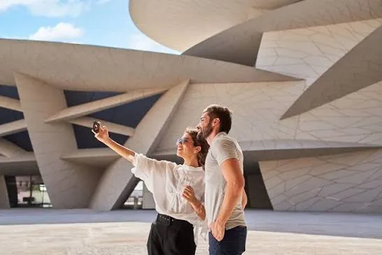 Visitors at the National Museum of Qatar desert rose building on a museums and culture tour