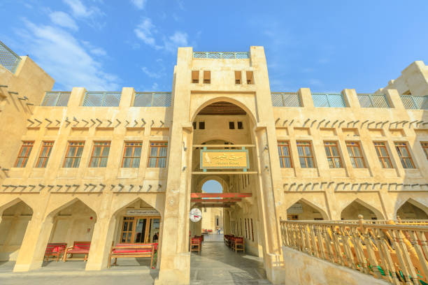 Doha, Qatar - February 18, 2019: facade of historic Falcon Souq entrance near Souq Waqif, a market selling live falcon birds and falconry equipment located in the center of Doha. Sunny blue sky.