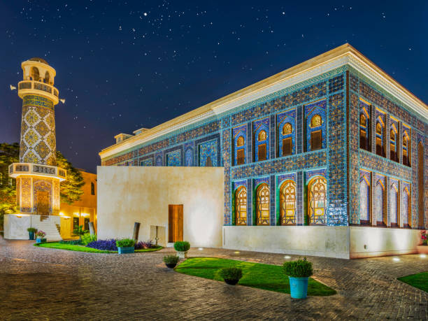 Village mosque illuminated with stars in the sky at night in katara village, Doha, Qatar